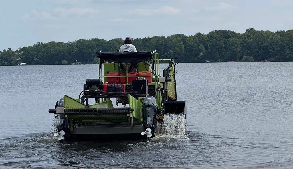 Aquatic plant harvester working on Pelican Lake