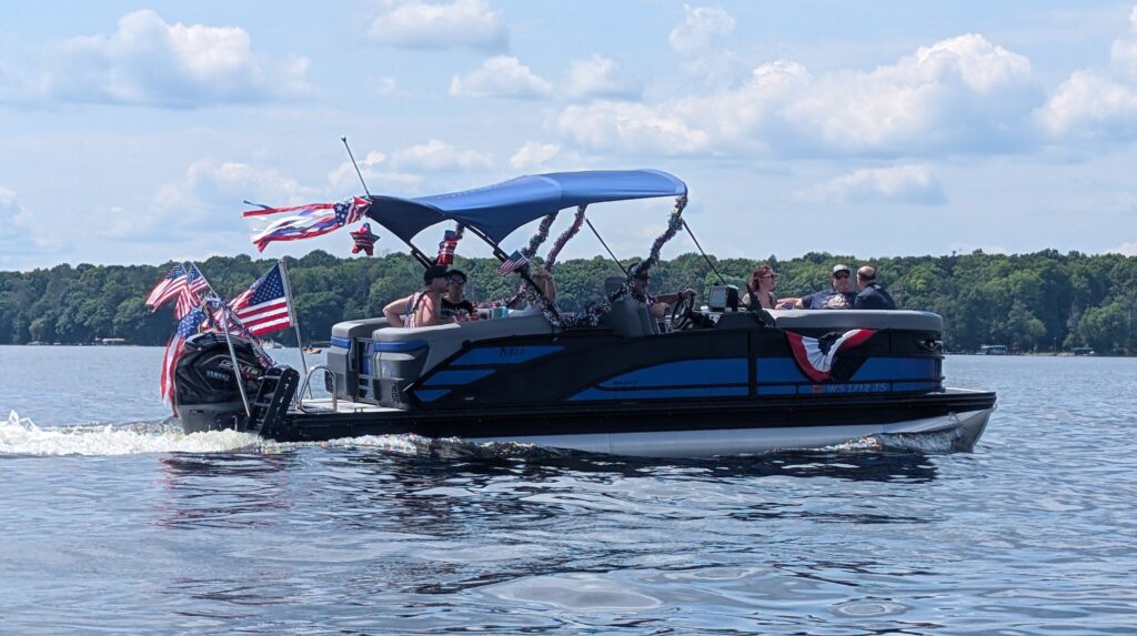 Pontoon boat decorated with American flags